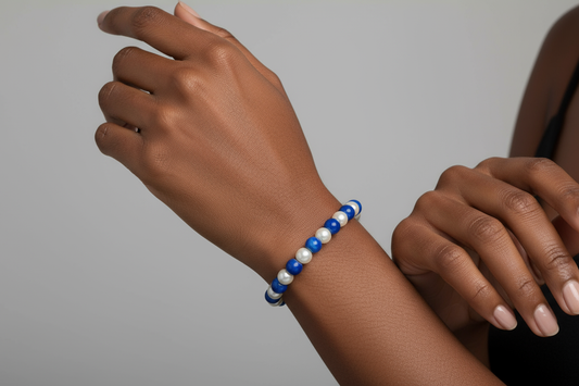 Black model wearing blue and white pearl bracelet