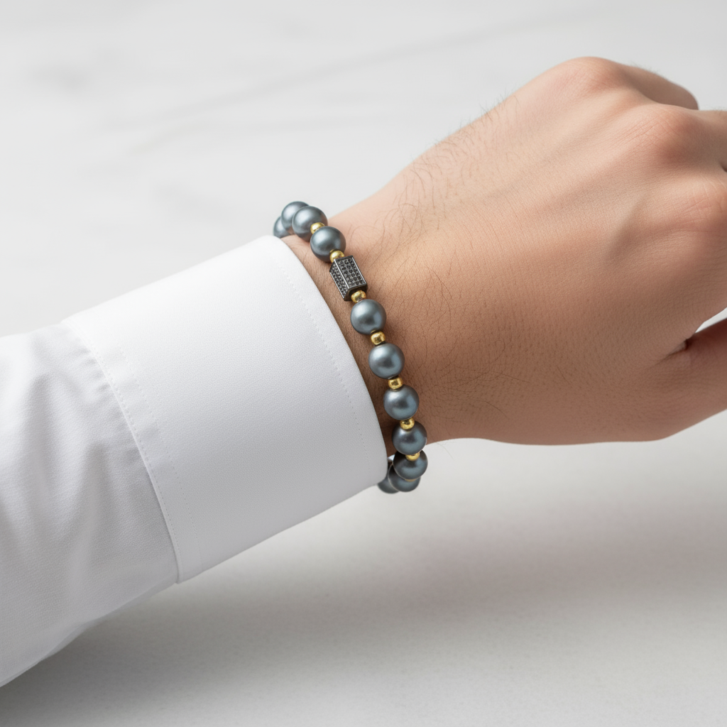 Man modeling gray and gold bracelet