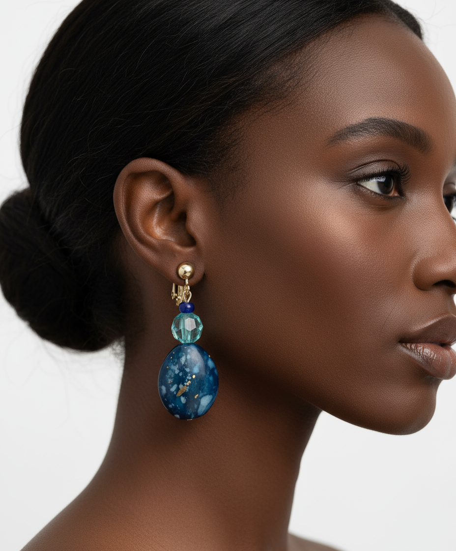 Model wearing blue green clip-on earrings