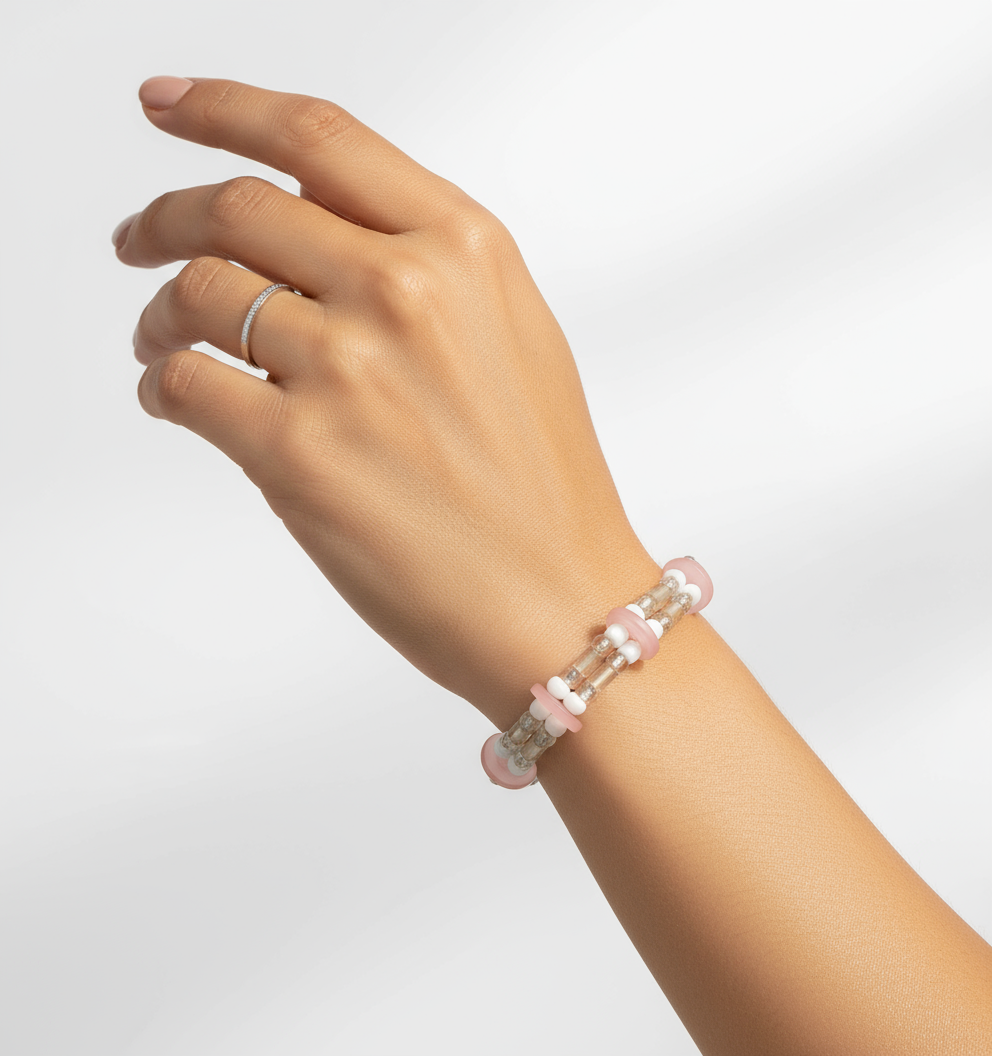 Latino model wearing pink button bracelet