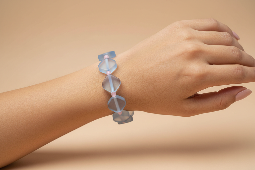 Model wearing light blue and pink glass bead bracelet