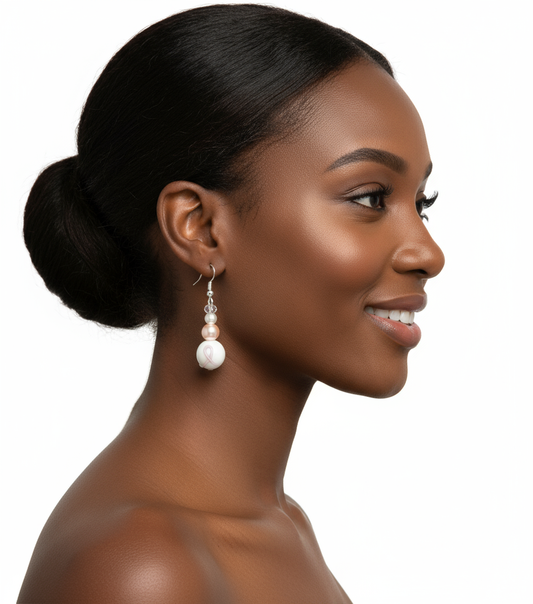 Model wearing pink ribbon awareness earrings