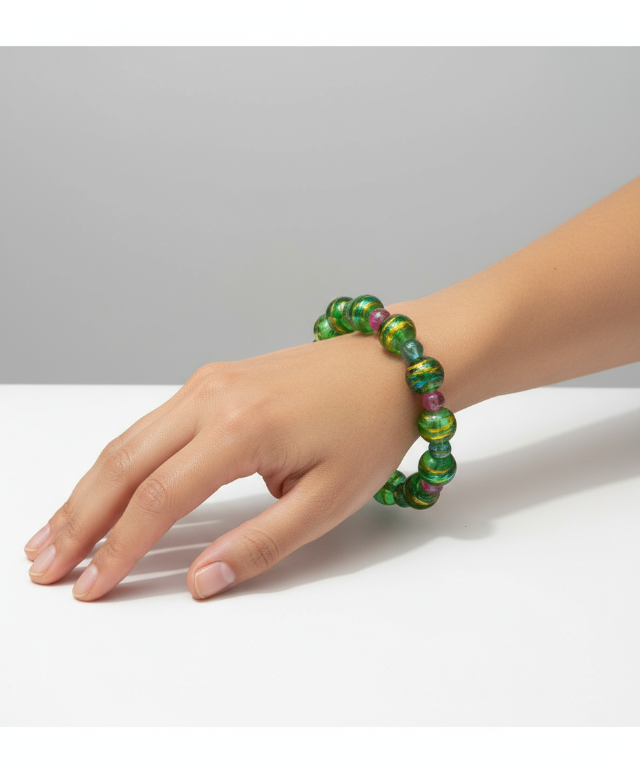 Model wearing vibrant green glass bead bracelet